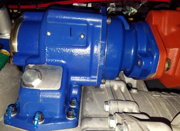 An image of a PTO installed on a transmission with witness marks painted onto torqued capscrews.