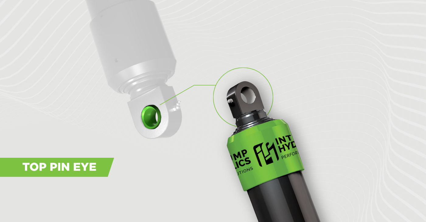 The image shows a transparent Pin-pin Cylinder with spherical top pin eye highlighted in green. Next to the transparent cylinder, is a non-transparent Pin-pin Cylinder with a circle and line highlighting the location of the top pin eye.