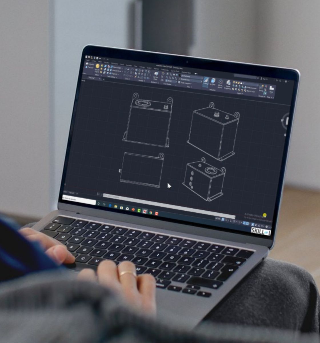 The image shows a man working on a laptop. On the laptop screen, a software to design custom tanks is being used.