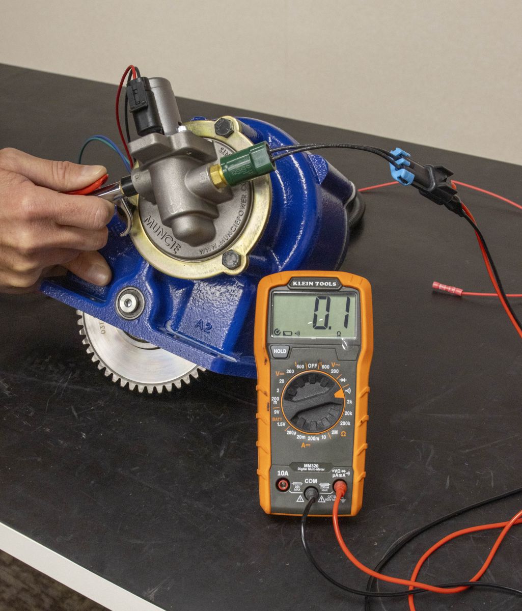 An image showing the testing of a pressure switch for continuity when PTO is engaged.