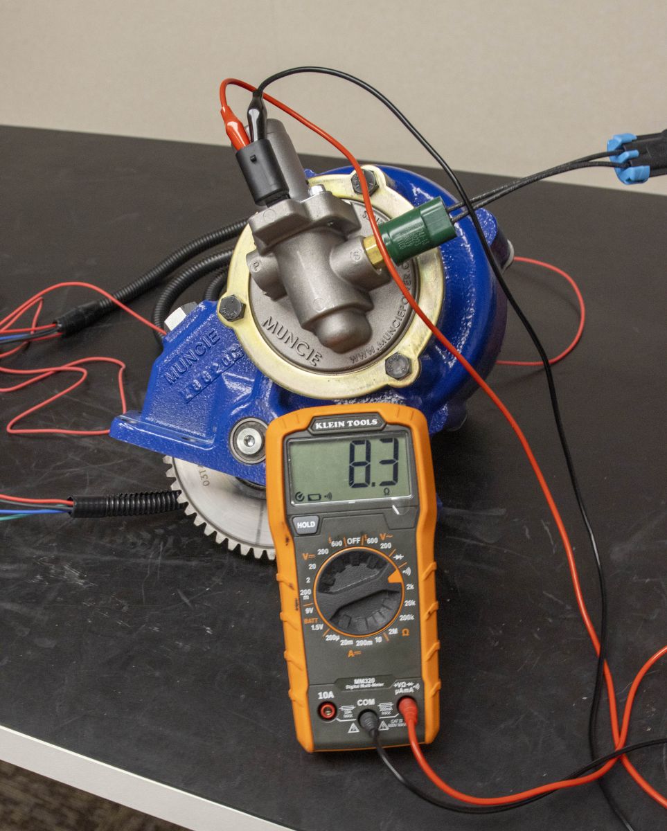 An image shows a test to check the solenoid valve coil resistance.