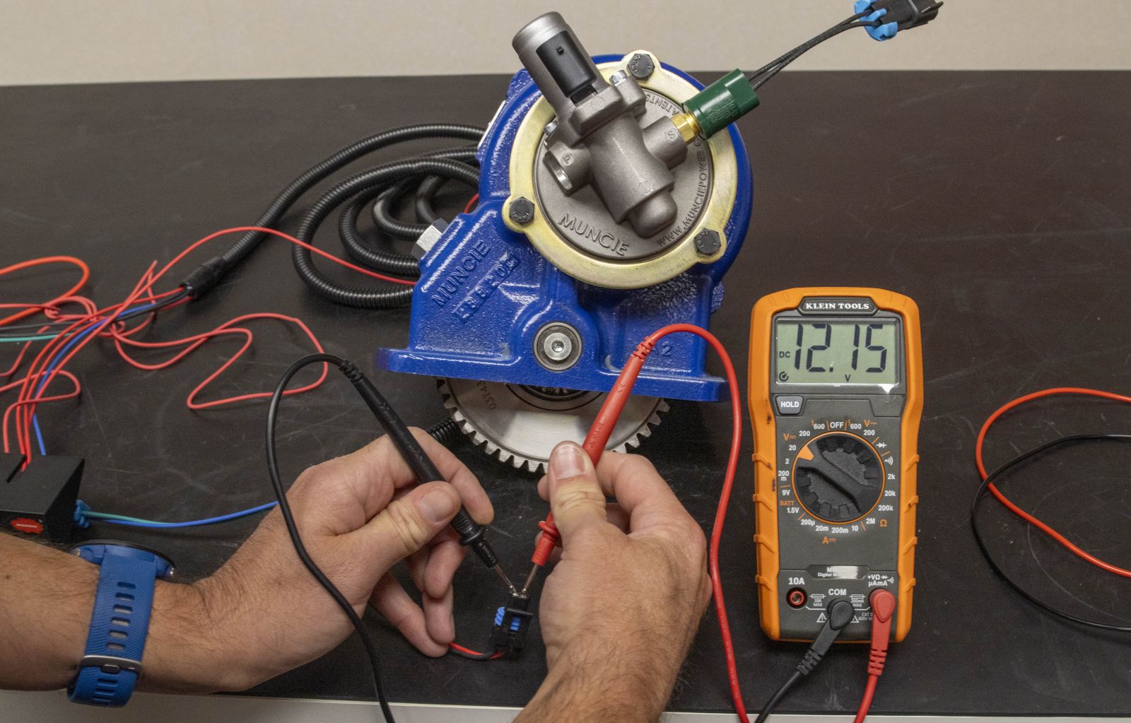 An image showing the testing for correct voltage at the PTO solenoid connector with the rocker switch turned on.
