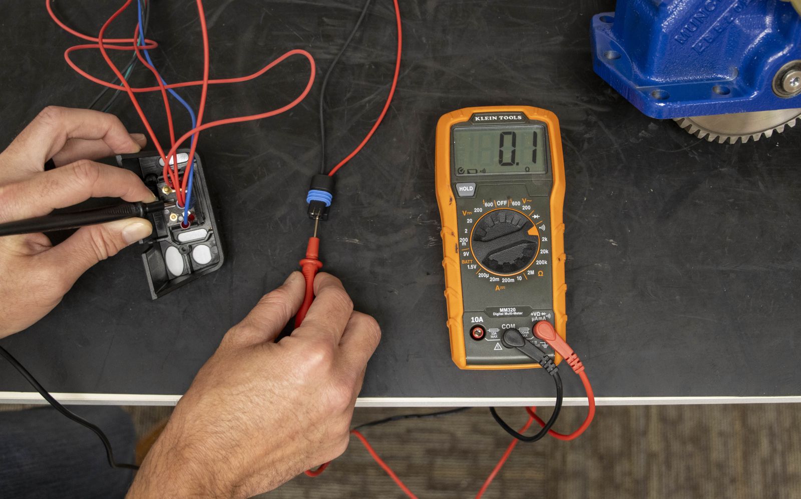 An image showing the testing of continuity between the rocker switch and PTO solenoid connector. 