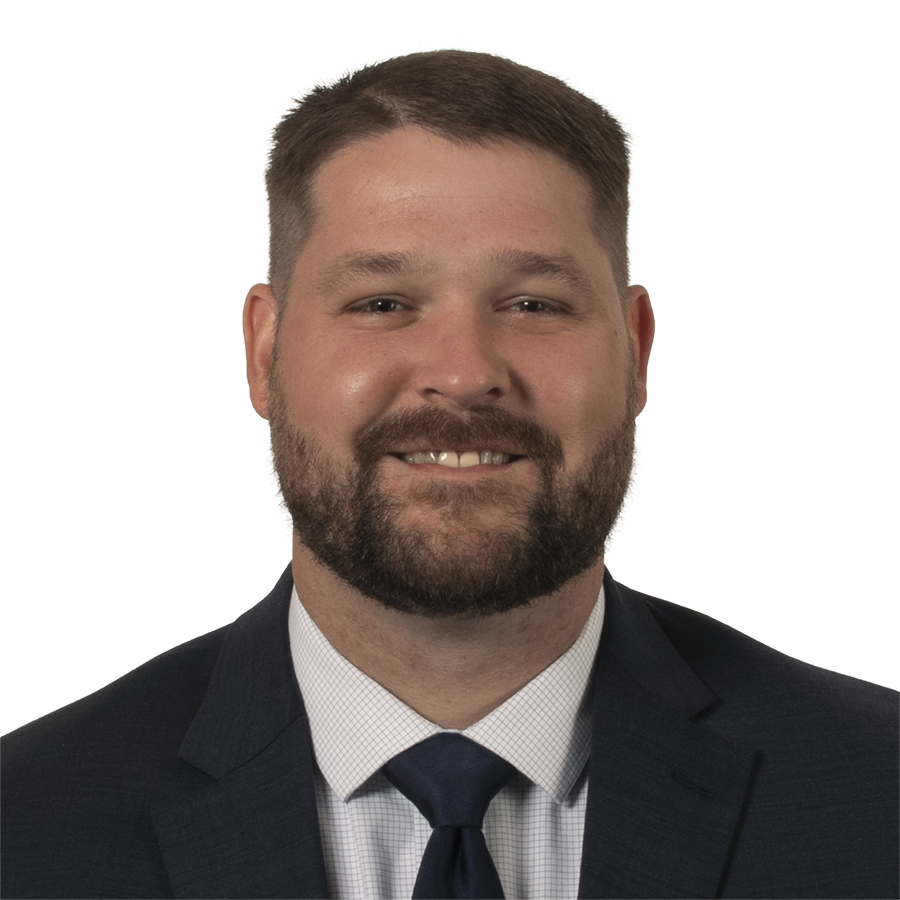 An image of a Tom Leman, who is wearing a suit jacket and tie.